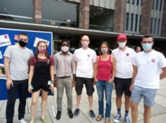 Eine Gruppe von Menschen mit Mund- und Nasenschutz am CSD 2020