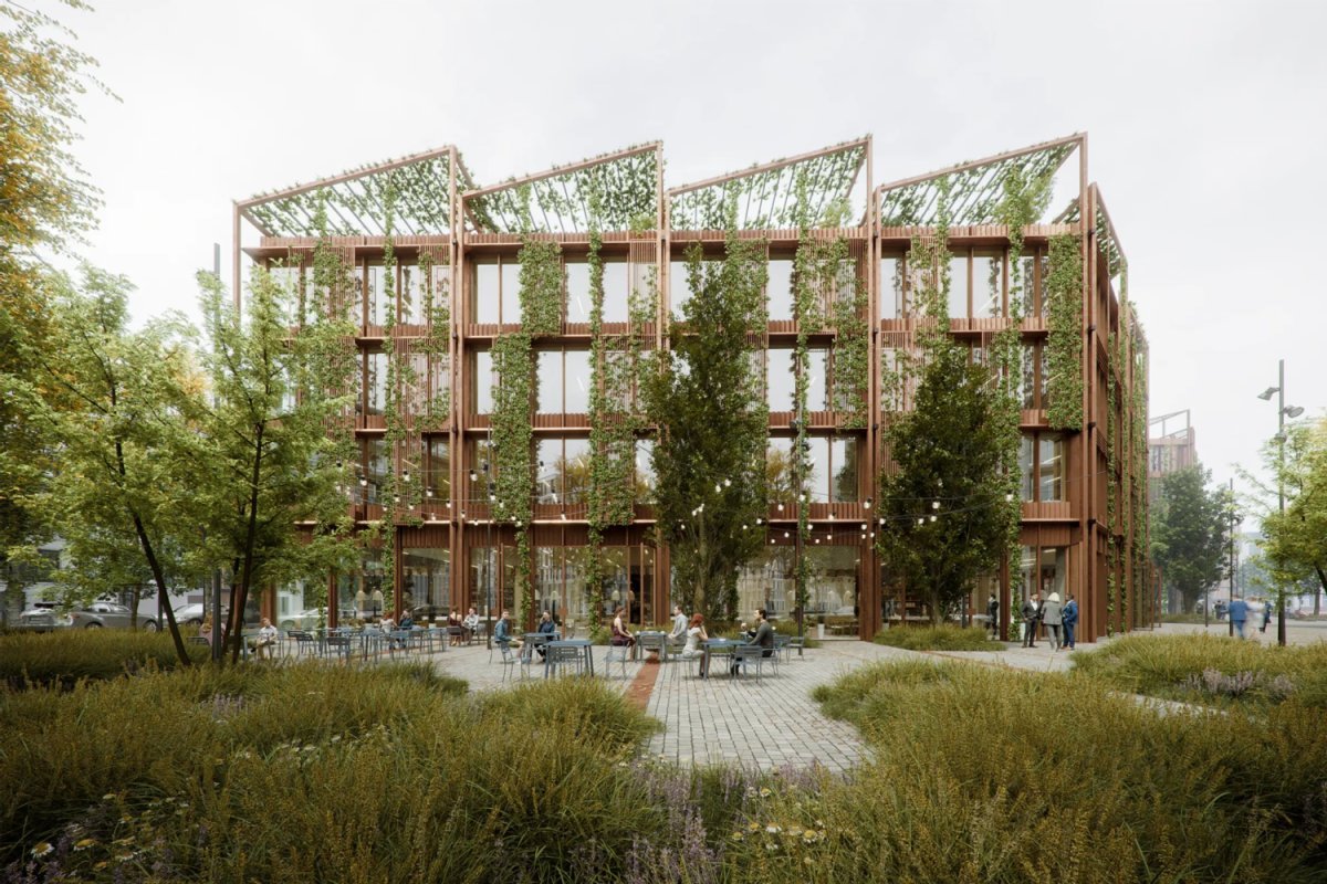 Ansicht des Gebäudes vom Grünen Platz, Urheber: Cobe Architekturbüro Gebäude mit begrünter Fassade, einem bestuhltem Platz, umgeben von Grünflächen