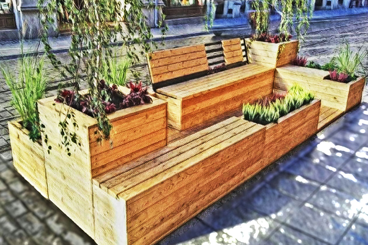 Parklet als Bank aus Holz mit Pflanzen und Blumen.